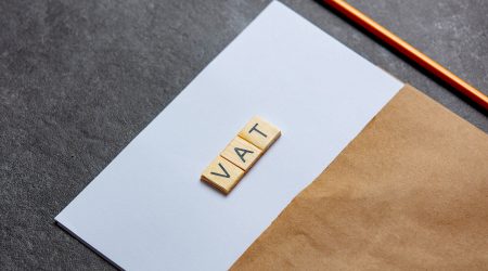 paper-sheet-and-pencil-with-vat-letters-on-gray-ba-2022-01-10-22-14-56-utc